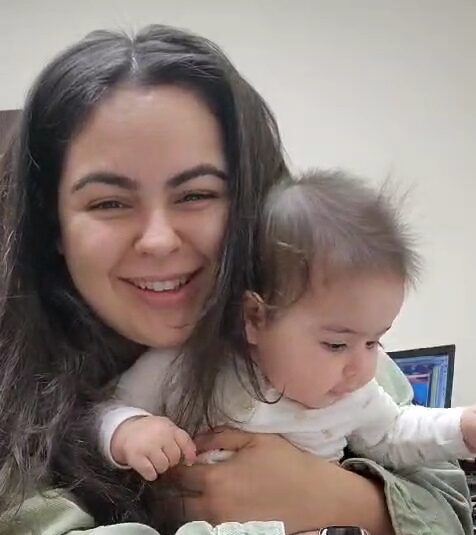 smiling mom with baby selfie